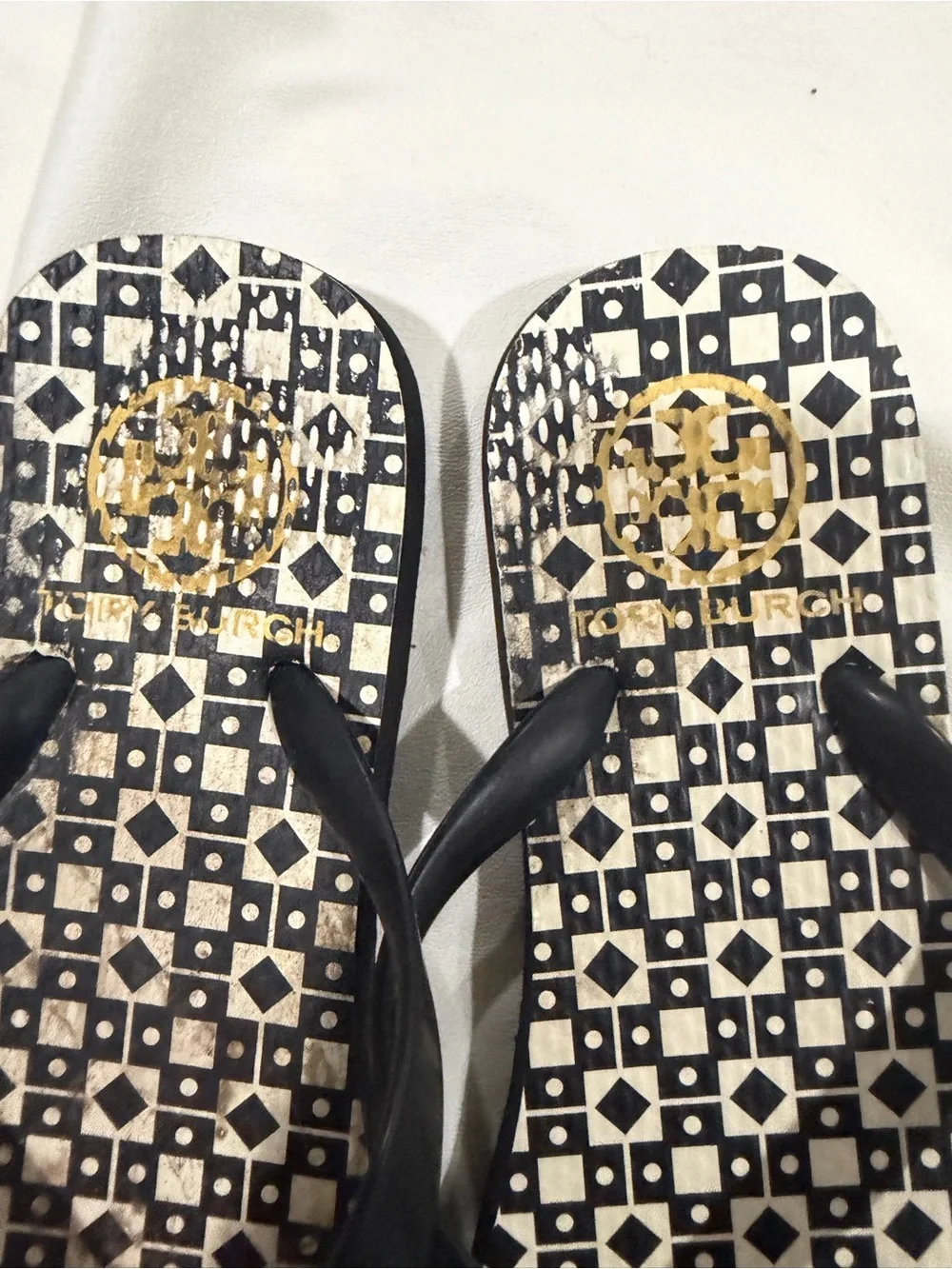 Tory Burch Black Strap Geometric Printed Flip Flops with Gold Medallions